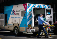 Silent Killer Stalks New Jersey Homes A healthcare worker pushing a stretcher next to an ambulance