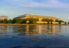 Drunk Boater Mows Through Family Outing Modern building reflecting on water during sunset