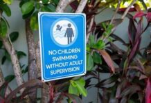 Backyard Pool Horror — Legal Fight Looms Sign indicating no children swimming without adult supervision