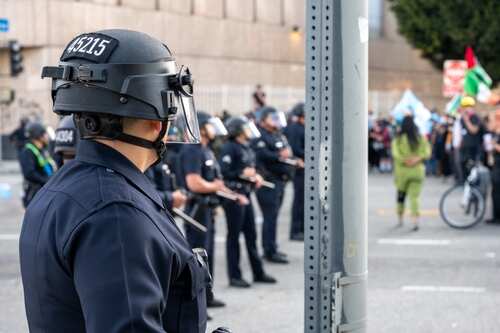 Los,Angeles,,Ca-apr,8,,2025:,Lapd,Officer,Stares,Down,Police Police officers in riot gear monitoring a protest