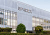 Exterior view of the SpaceX building featuring a modern design and glass windows