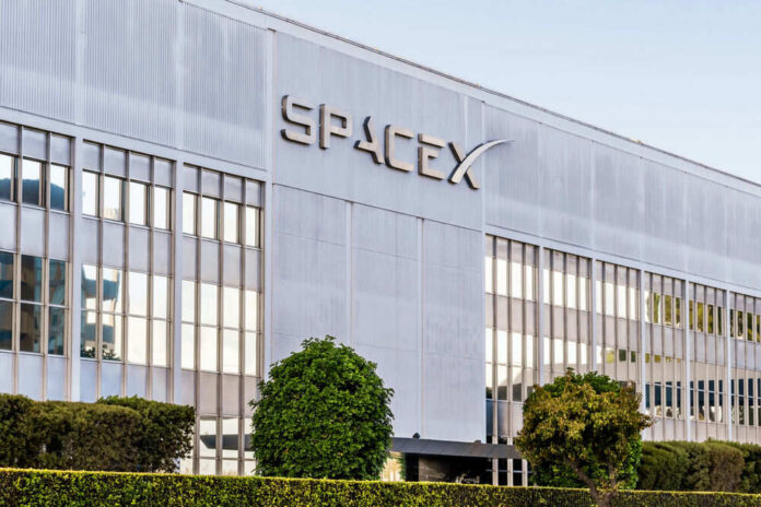 Exterior view of the SpaceX building featuring a modern design and glass windows