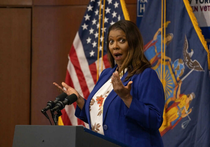 2222138605 Person speaking with surprised expression at podium flags behind