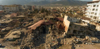 Cityscape with collapsed buildings and rubble after earthquake