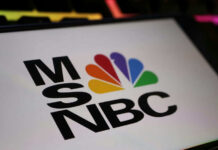Iran Plot Mentioned—Then Giggles? MSNBC logo with colorful peacock emblem.