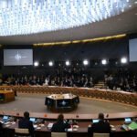 Trump Slashes War Games — Allies Rattled Conference room with large round table and attendees