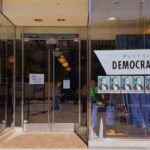 Late Ballots Upend L.A. Race Storefront of Westside Democratic Headquarters with signs.