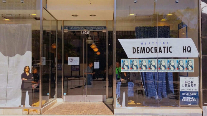2518101541-1 Storefront of Westside Democratic Headquarters with signs.