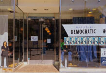 Money Meltdown Hits Democrats Storefront of Westside Democratic Headquarters with signs.