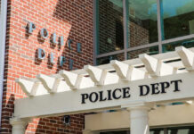 Graphic Jail Video Triggers LAPD Reckoning Police department building with brick facade and signage.