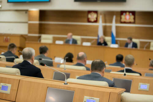 Session,Of,Government.,Conference,Room,Or,Seminar,Meeting,Room,In Audience attending a government meeting in a conference room