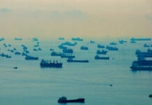 Pirates Hijack Tanker — Ransom Numerous cargo ships scattered across a hazy ocean