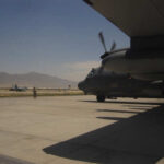 U.S. Just Snatched Russian MiGs? Military aircraft on an airfield with a crew member in the foreground