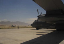 U.S. Just Snatched Russian MiGs? Military aircraft on an airfield with a crew member in the foreground