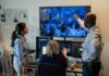 TV Star Hit With Explosive Lawsuit Three professionals analyzing security footage on multiple screens
