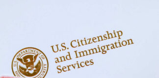 U.S. Citizenship and Immigration Services logo with document.