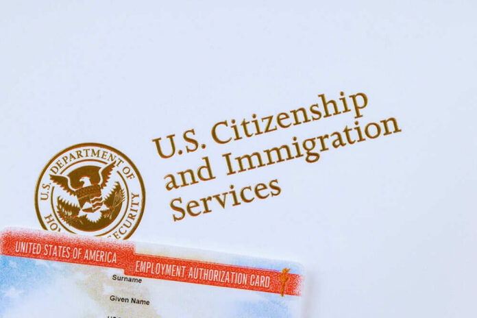 2411503903 U.S. Citizenship and Immigration Services logo with document.
