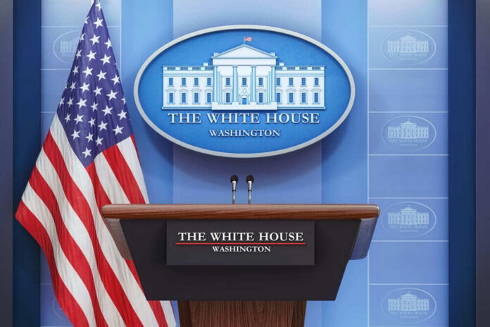2415827183 Podium with microphones in front of American flag