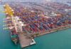 Aerial view of a busy shipping container port.