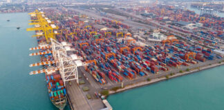 Aerial view of a busy shipping container port.