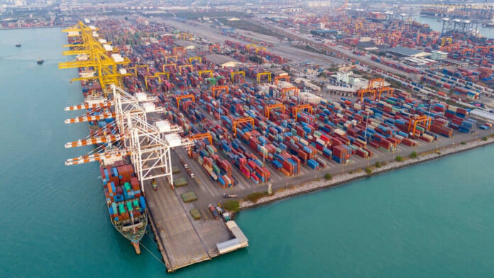 Aerial view of a busy shipping container port.