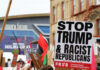 Protest signs against Trump at outdoor rally event