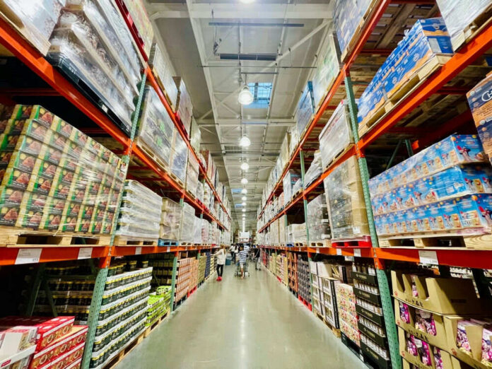 2509253361 Warehouse aisle filled with stacked products on shelves
