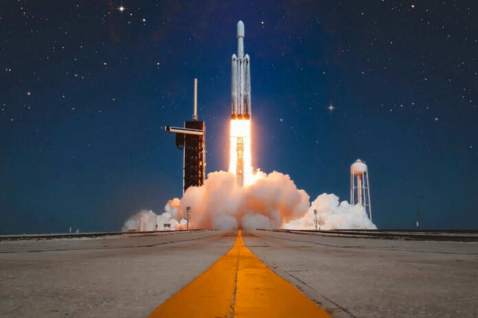 2535637225 Rocket launching into the night sky with stars