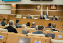 California Gags Reporters? Audience attending a government meeting in a conference room