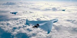 Three drones flying above the clouds in a clear sky