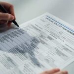 A person filling out an official ballot for a general election