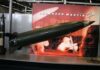 A missile model displayed at a trade show with Lockheed Martin branding