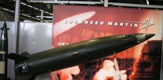 A missile model displayed at a trade show with Lockheed Martin branding
