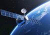 Satellite orbiting Earth with solar panels visible