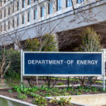 Sign for the Department of Energy in front of a government building