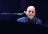 A musician performing at a piano during a concert