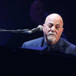 A musician performing at a piano during a concert